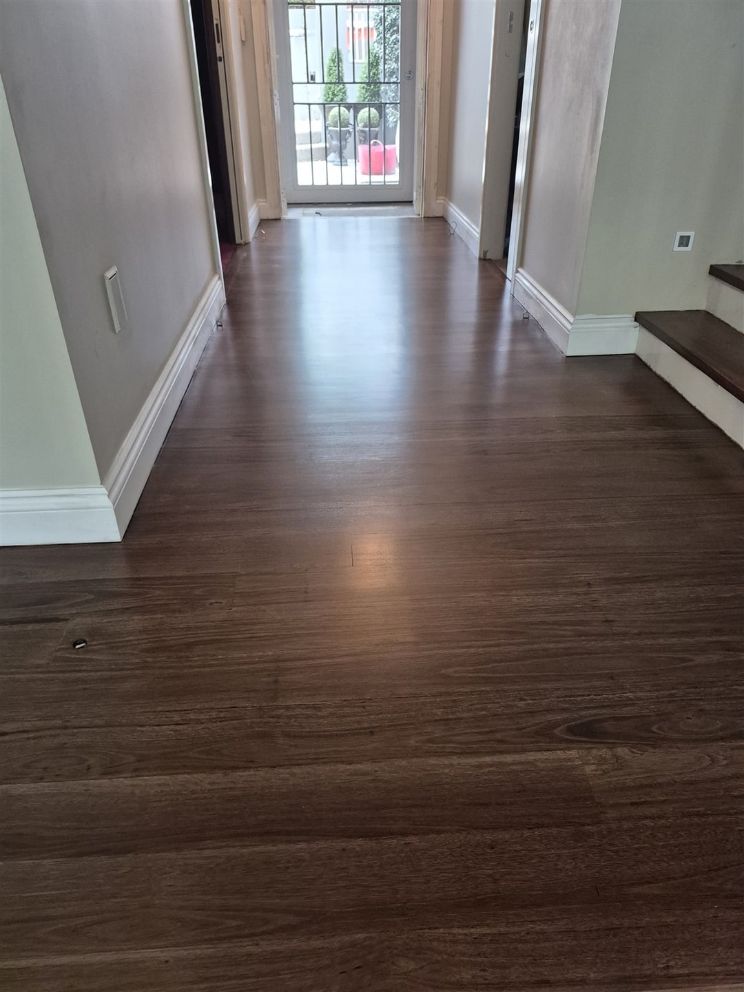 Dark-stained hallway leading to the front door, Brisbane