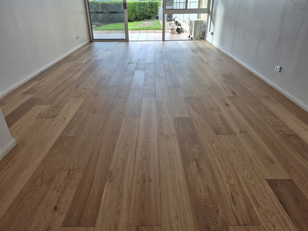 Engineered oak running to glass doors and the garden, Brisbane