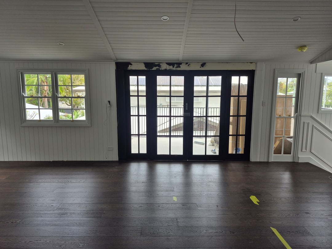 Walnut engineered timber living room with French doors, Graceville, Brisbane