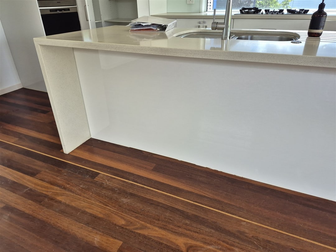 Jarrah floor alongside the white kitchen island, Brisbane