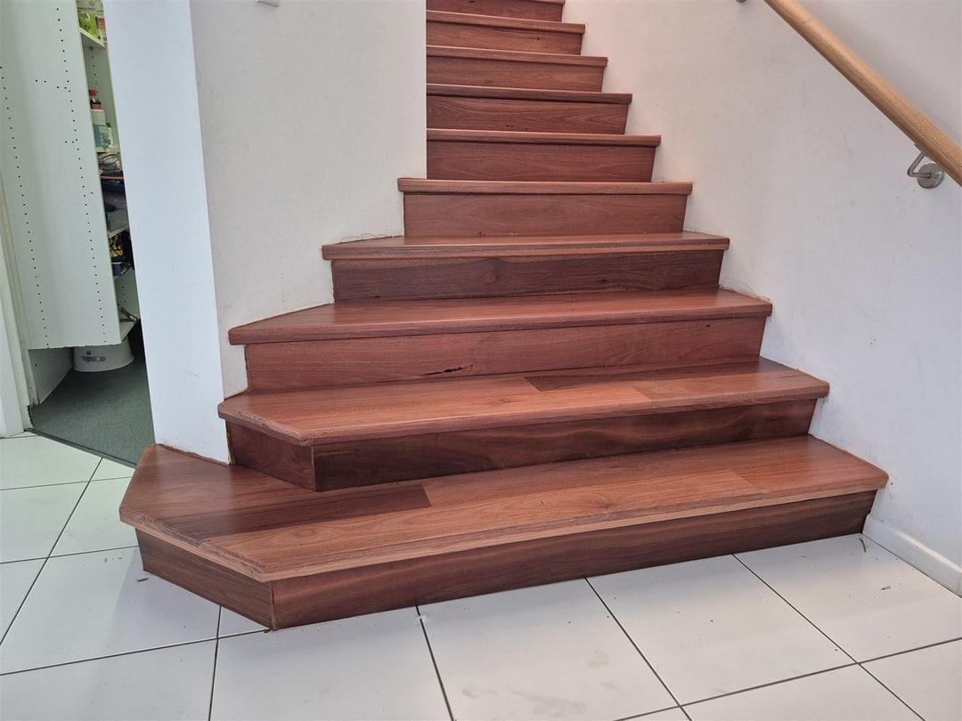 Angled jarrah bottom steps on tiles, Brisbane