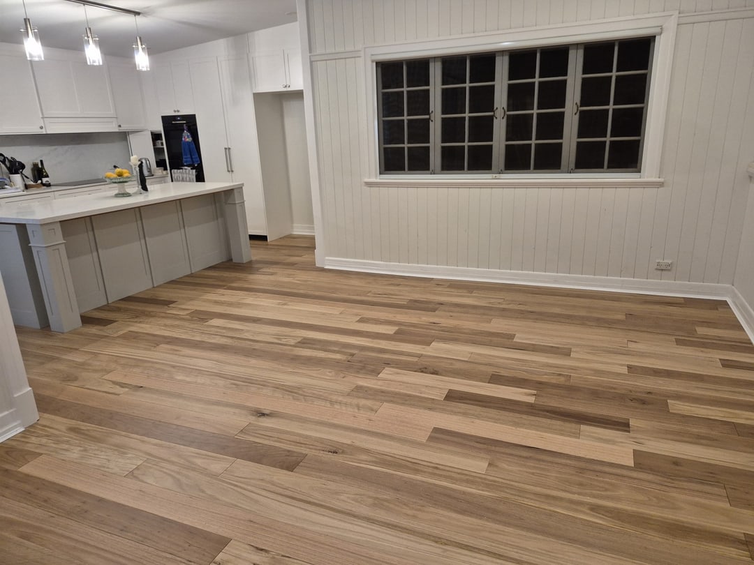 Wide view of the kitchen island and window wall over the new blackbutt floor, Sandgate, Brisbane